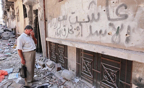 Sejak 2012, milisi-milisi pendukung Asad semprotkan “الأسدأو نحرق البلد” (Pilih Asad atau Kami Bakar Negeri/Kota/Desa Ini) di tembok-tembok di seantero Suriah, termasuk di Aleppo